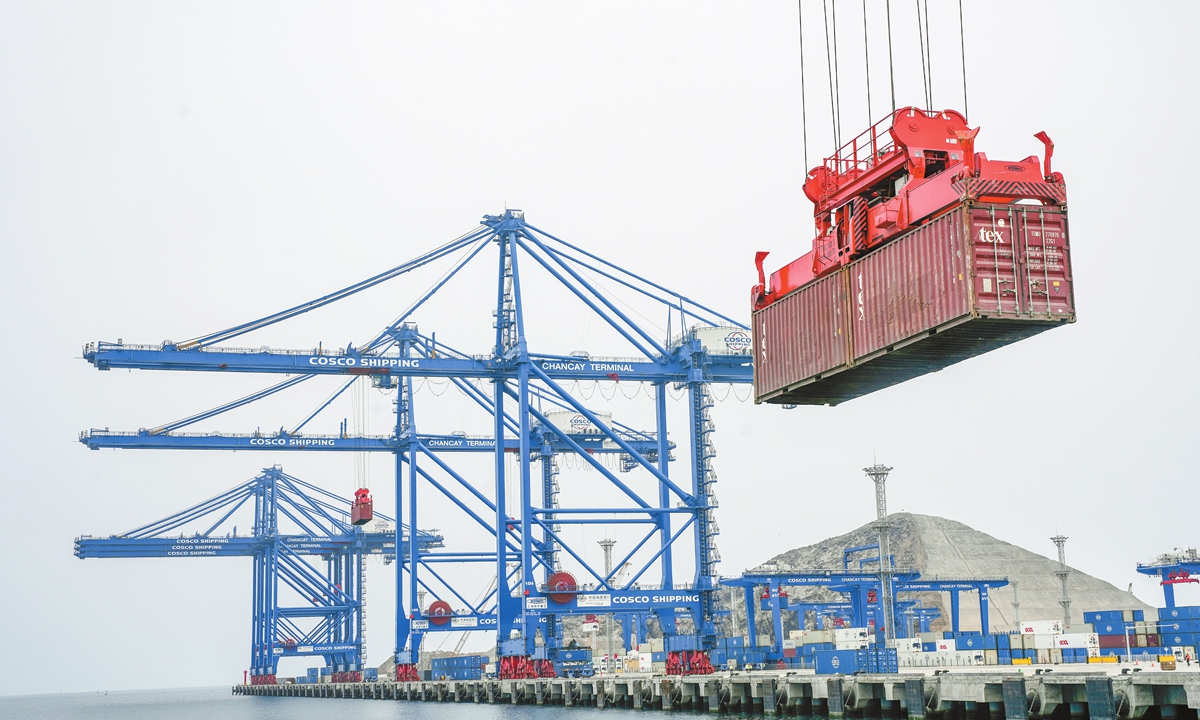 A crane lifts a container amid construction at the Chancay Port, Peru, on October 29, 2024. Photo: VCG