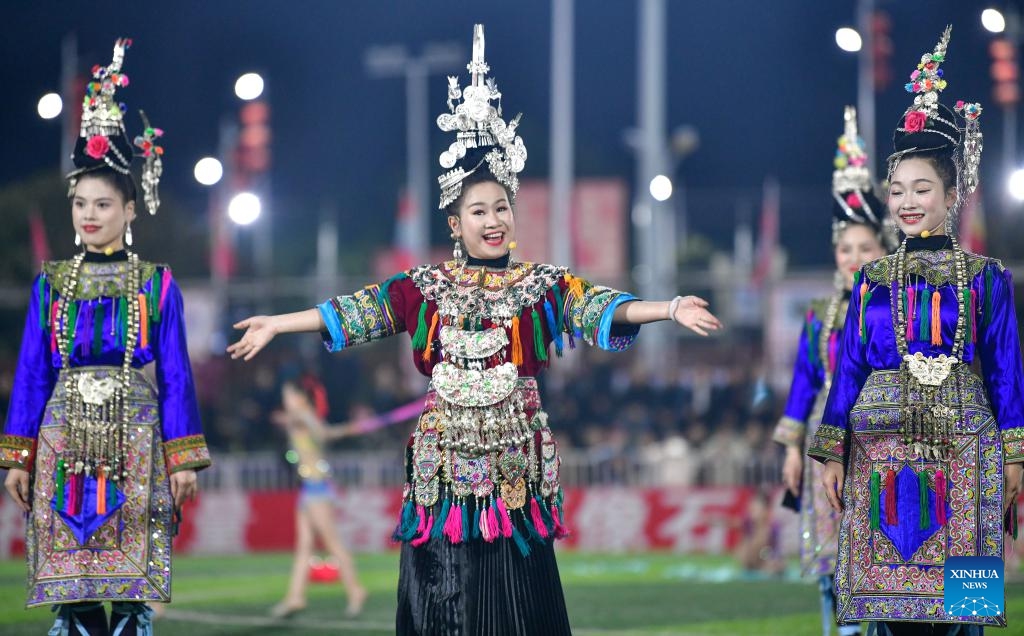Chorus members perform the grand song of the Dong ethnic group in Ne Zha 2 during the Village Super League, a grassroots football carnival in Guizhou, in Rongjiang County, southwest China's Guizhou Province, March 14, 2025. （Photo: Xinhua)