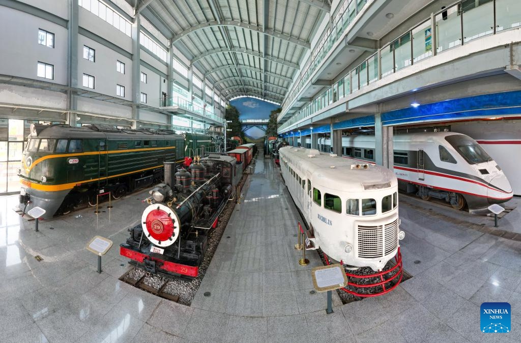 A panoramic drone photo shows trains from different period of time at Yunnan Railway Museum in Kunming, southwest China's Yunnan Province, May 14, 2025. Housed in Kunming North Railway Station, the Yunnan Railway Museum takes the century-long development history of Yunnan railway as the leading story line to narrate the frog-leaping evolution railway gauge standards from meter gauge to inch gauge, and standard gauge, as well as railway technologies from steam locomotives to high-speed rails. (Photo: Xinhua)